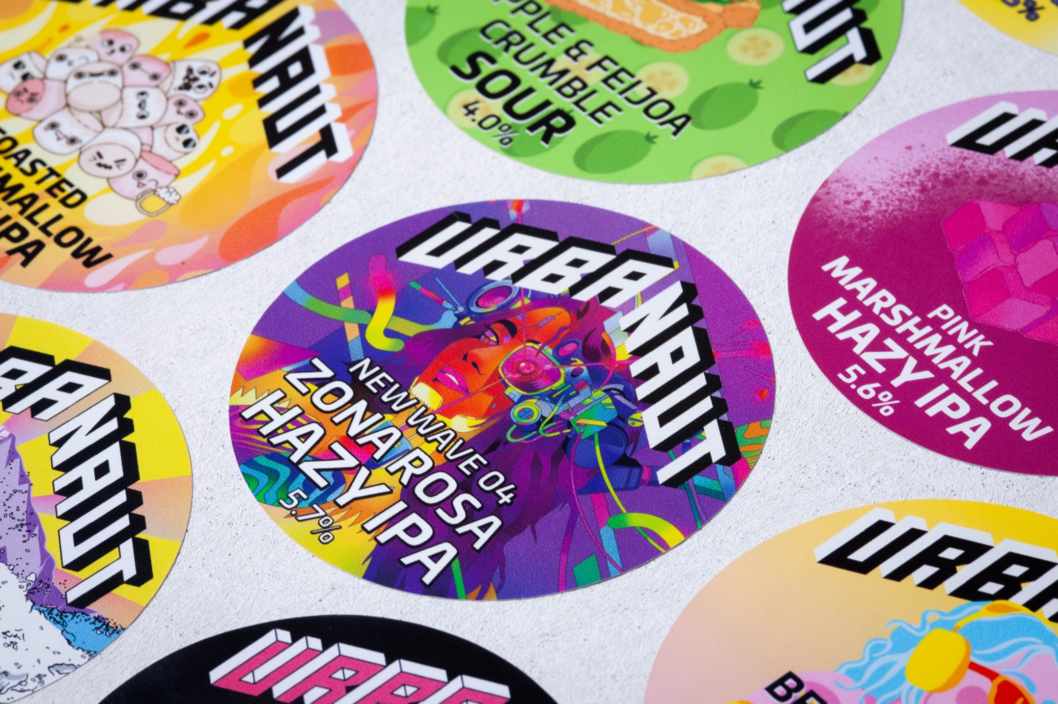 Custom printed tap badges for Urbanaut Brewing Co. using removable vinyl with bold colour graphics.
