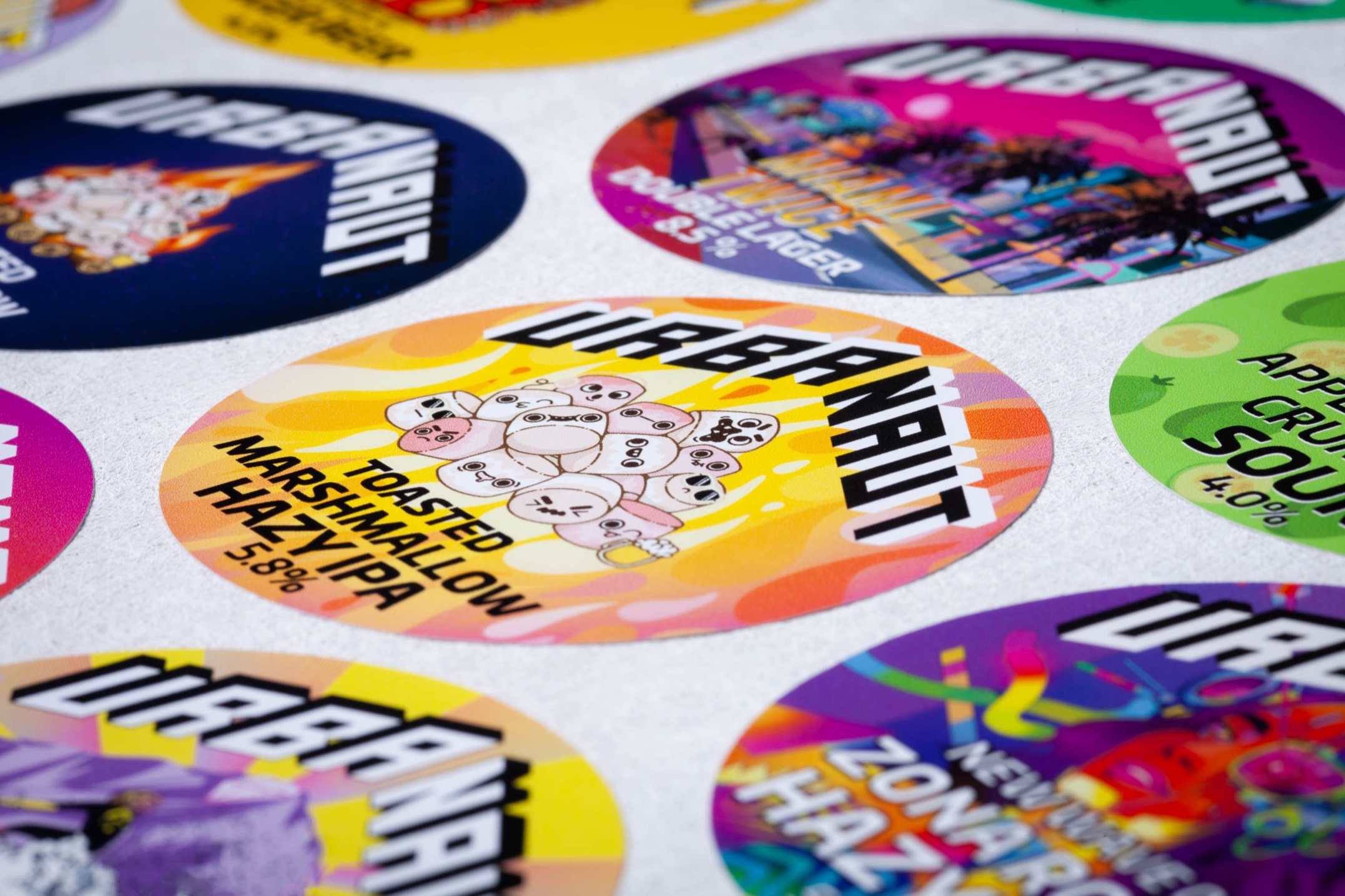 Custom printed tap badges for Urbanaut Brewing Co. using removable vinyl with bold colour graphics.