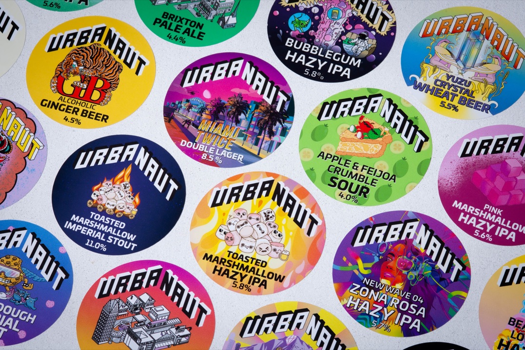 Custom printed tap badges for Urbanaut Brewing Co. using removable vinyl with bold colour graphics.
